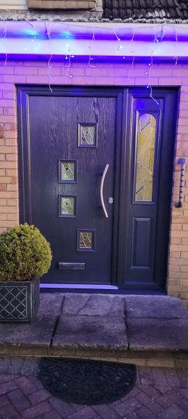 Anthracite Grey composite door with curved bar handle 
